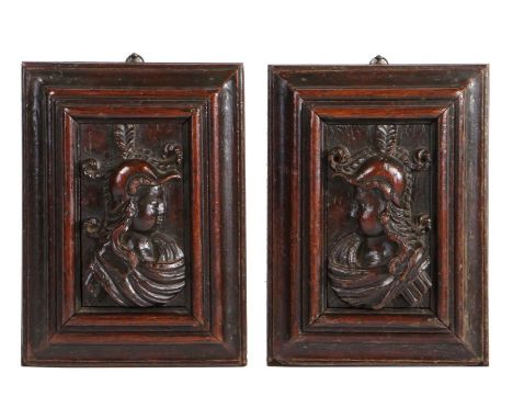 Two 16th Century carved oak panels, north Italian A dexter and sinister bust profile, of a Centurion-like soldier, each weari