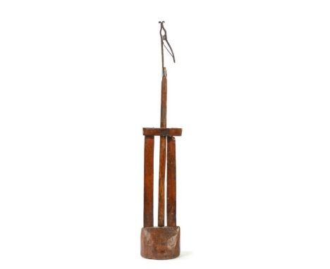                         An 18th century floor standing peerman, with iron rush light scroll-ended nips, adjustable height bas