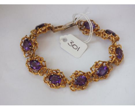 Decorative 9ct. gold amethyst set bracelet 13cm 35g.   