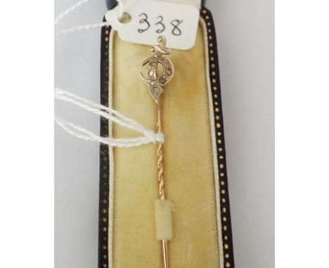 Diamond mounted stick pin set in gold – boxed     