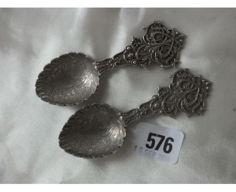 Heavy pair of Indian caddy spoons, stamped O.M, BHUJ   