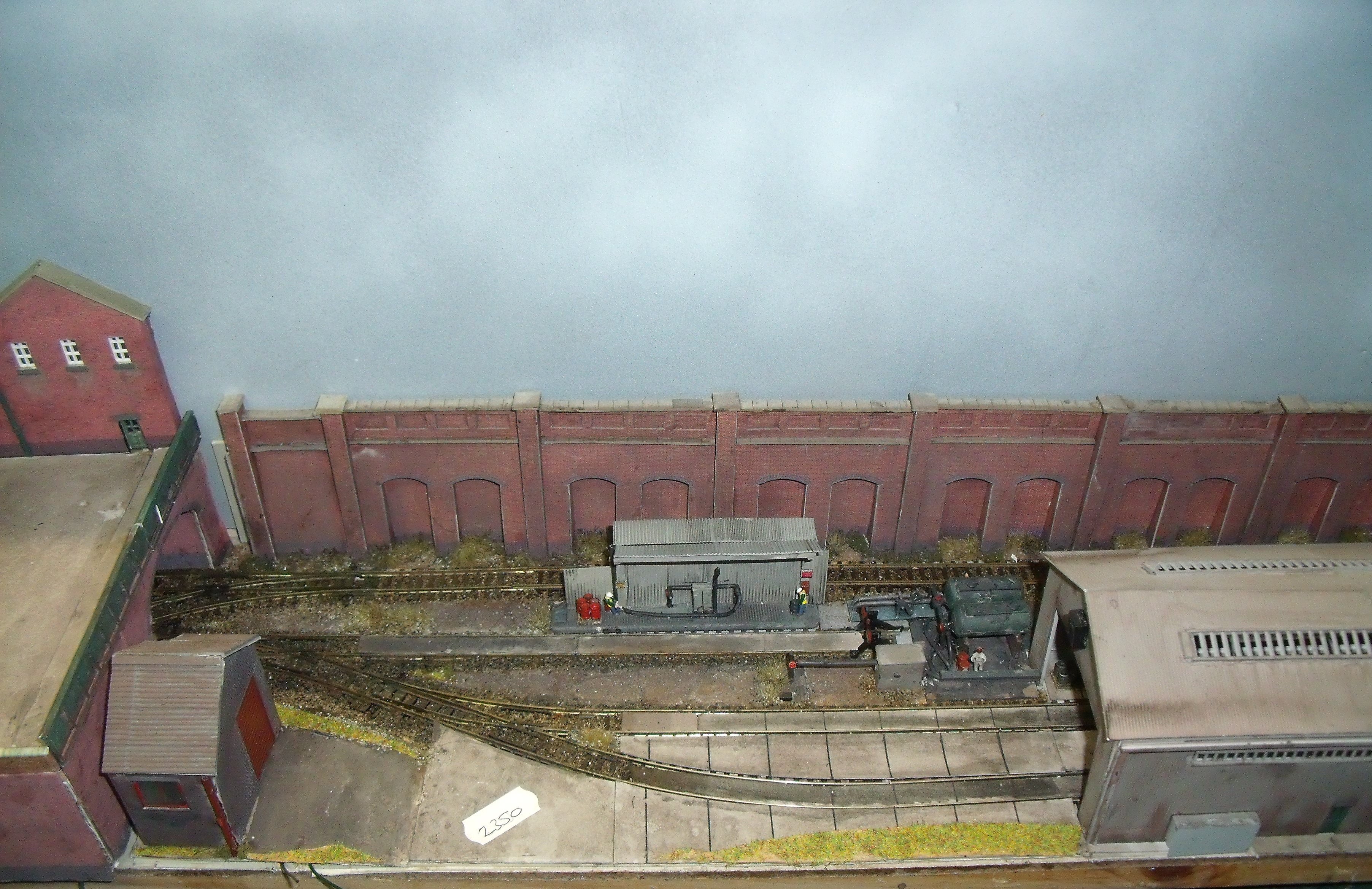 N gauge end to end model railway layout with four lines, card scenic's etc (in three sections 122