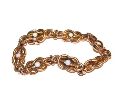 An opal decorated 9 carat gold curb link bracelet