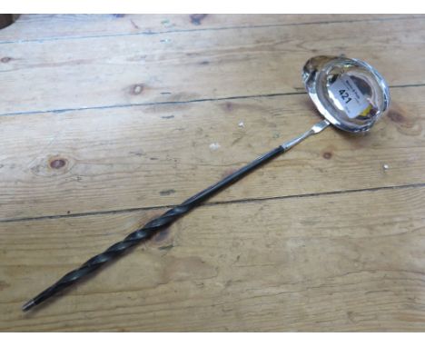 A Georgian silver punch ladle with whale bone handle