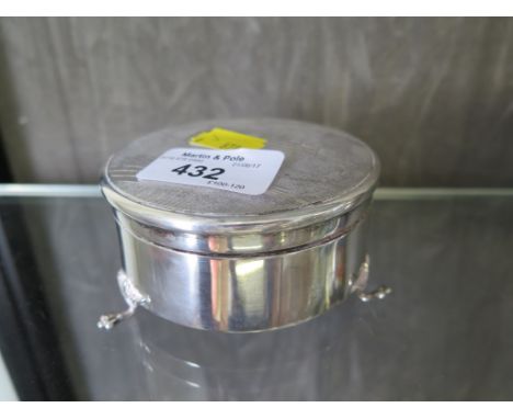 A silver trinket box with engine turned decoration to lid, a small silver candlestick, a pair of silver napkin rings, a silve