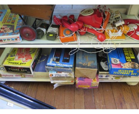 Various toy telephone intercom sets, including Johnny Seven and Playcraft, a Chad Valley Give-a-show projector and other toys