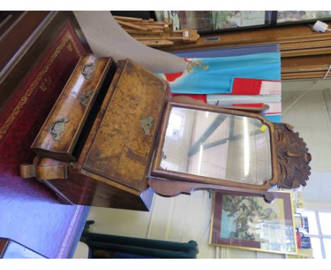 An 18th century Dutch walnut desktop bureau and toilet mirror, the mirror with foliate carved crest over a sloping fall enclo