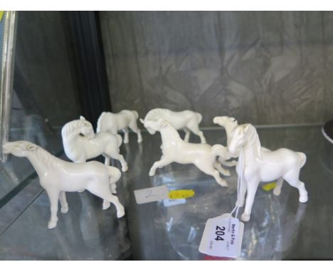 Seven white Ceramic horses, possibly Chinese, 8cm high