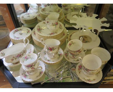 A Royal Albert Moss Rose part tea and dinner service for eight place settings and a commemorative plate