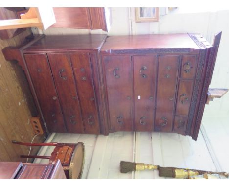 A George III mahogany chest on chest, the dentil cornice over a blind fret carved frieze and canted sides with three short an