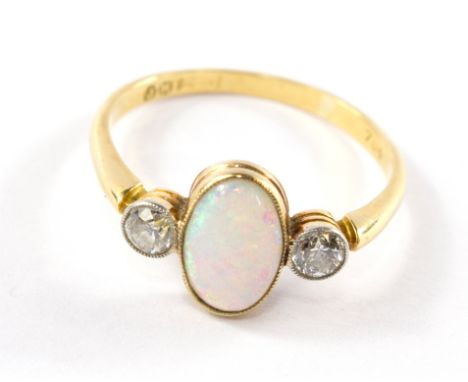 An opal and diamond three stone ring