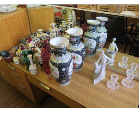 A pair of Dartington red glass spill vases, a pair of Chinese style famille noir vases, a Nao figure of a boy and a dog, vari