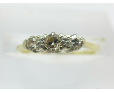 An 18ct gold and three stone diamond ring, 1.5g, J