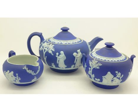 A Wedgwood dark blue Jasper three piece tea service