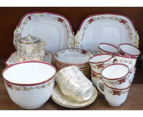 A Davenport burgundy and gilt tea service and matching Shelley tea plates and T.F.&amp;S. tea for two tea set, Phoenix patter