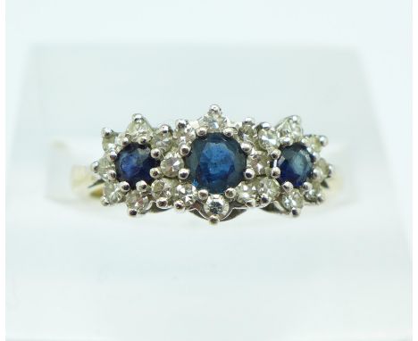 A 9ct gold, sapphire and diamond triple cluster ring, 2.8g, N