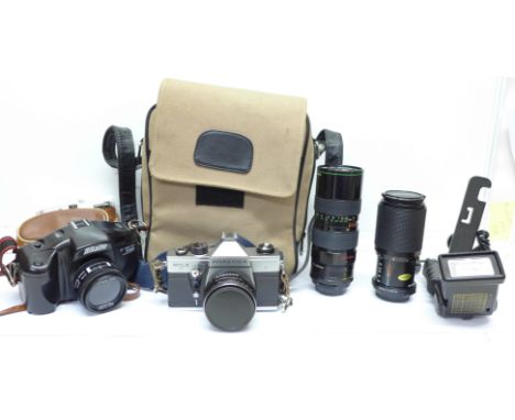 A Praktica MTL 5 35mm film camera, spare lens and two other cameras