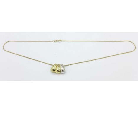 A 14ct gold and diamond triple pendant on a 9ct gold chain, total weight 6.7g