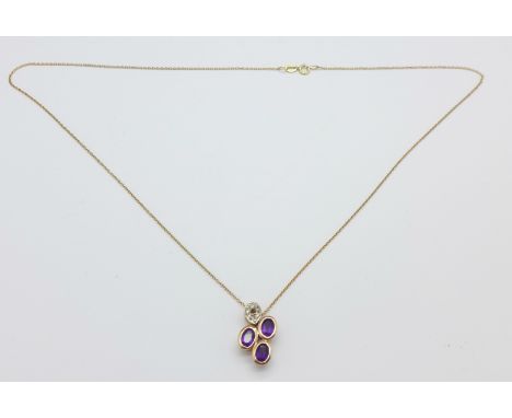 A silver gilt pendant on a 9ct gold chain