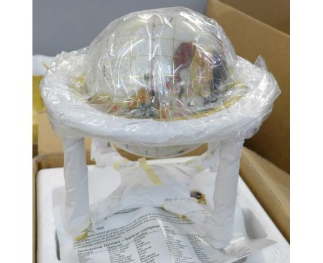 A gem set globe