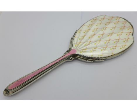 A silver and enamel hand mirror