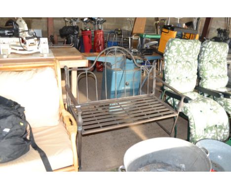 An ornate metal garden bench