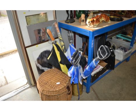A stick stand with contents of umbrellas; and a wicker basket