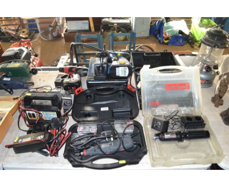 A collection of electrical power tools to include a work zone cordless drill, Black &amp; Decker jigsaw, rotary tool, battery