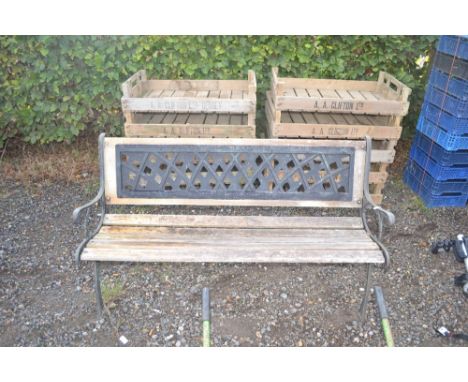 A cast iron and wooden garden bench