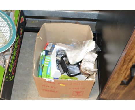 A box containing various cutlery, kitchen scales etc.