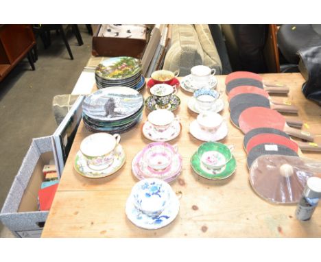 A quantity of various collectors plates and decorative porcelain cups, saucers and trios