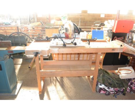 A wooden work bench with built in vices