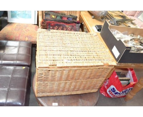 A wicker picnic hamper lacking contents