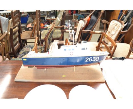 A model boat on stand
