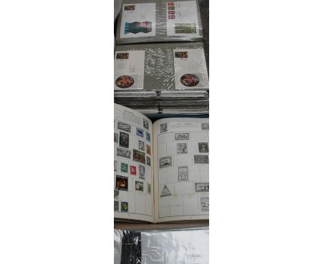 A stamp album together with first day covers and other stamps