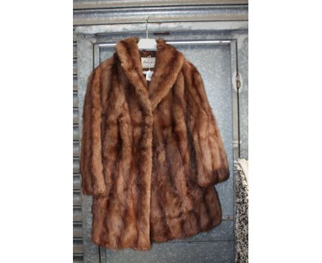 A ladies brown Fur Coat by Harrisons of Worcester and Luton