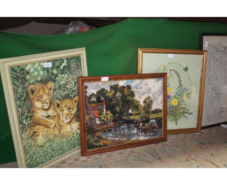 Three framed Tapestries including flowers in a basket, lions and a Constable scene.