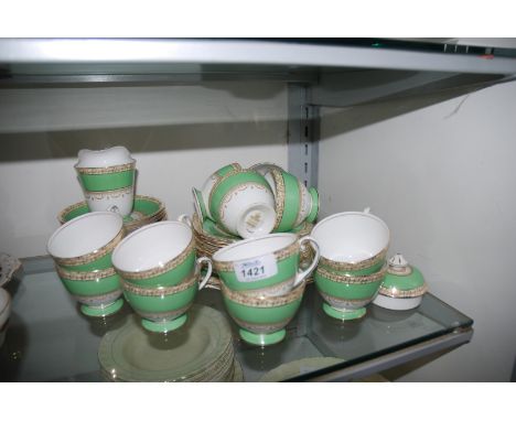 A Royal Standard bone china part Teaset including sandwich plates, eleven tea plates, twelve cups and saucers, etc., in green
