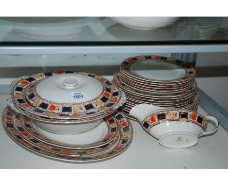A Coronation Ware 'Khedive' Dinner service including two tureens one with a lid, three graduated oval meats, six side plates,
