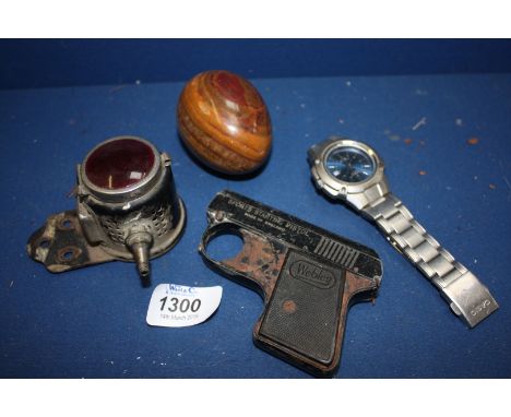 A British Miller made Bicycle light, Webley sports starting pistol, stone egg and Casio quartz watch