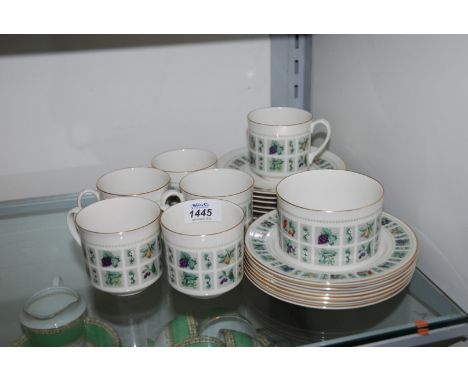 A Royal Doulton Teaset (English Translucent) comprising six cups, saucers and tea plates plus a sugar bowl 'Tapestry' design