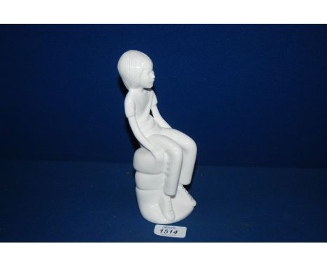 A white Spode figure of a seated boy, ''Michael'' by Pauline Shore 