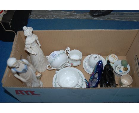 A quantity of china including three Royal Worcester soup bowls with saucers, Wedgwood cup and saucer, two figures of Ladies, 