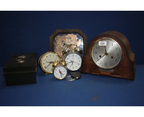 A wooden cased chiming Mantel Clock for restoration, three alarm clocks, metal cash tin, small old wooden framed mirror, a/f,