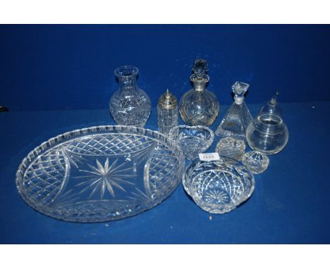 A quantity of glass perfume bottles, glass vase, heart shaped trinket trays, all on glass oval tray