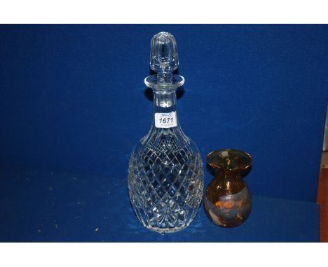 A Brierley crystal decanter and a Medina glass vase.