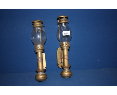 A pair of brass White Star, Liverpool wall bracket Candle holders