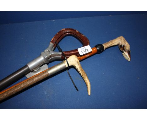 A Horn handled Whip, goat's foot Walking Stick and a Shooting Stick.