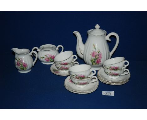 A Japanese made Child's Teaset comprising six cups and saucers, teapot, milk jug and sugar bowl