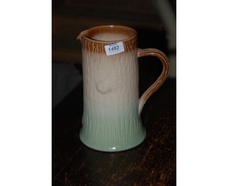 A large Tree Trunk Jug, 9 3/4'' tall.
